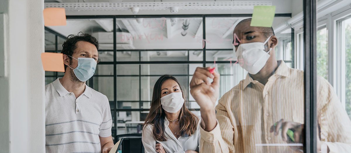 3 people wearing masks coming up with a plan