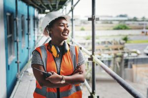 A young woman engineer working at a construction site