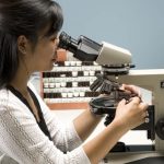 Lab analyst analyzing asbestos